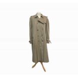 A men's Burberry trench coat, approximate size medium.Condition report: Very clean condition, inside