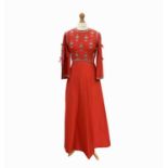 A 1960s Norman Hartnell full length red evening dress, embroidered with sequins and pearl beads to