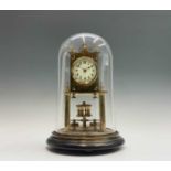 A German brass 400 day torsion clock, circa 1920, the cream enamel dial with Arabic numerals,
