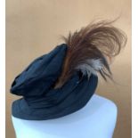 A stylish Edwardian black taffeta hat with copper, black and cream feathers in a Messrs G A Dunn &
