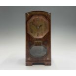 A Jugendstil oak and copper cased torsion clock, with glass bevel edge panels, the movement