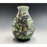 A Moorcroft 'Islay' baluster vase, designed by Emma Bossons, having tube lined floral and coastal