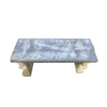 A Garden bench, the associated stone top raised on a pair of composite stone supports cast as