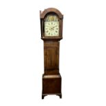A late George III mahogany and crossbanded eight-day longcase clock, the painted dial with rocking