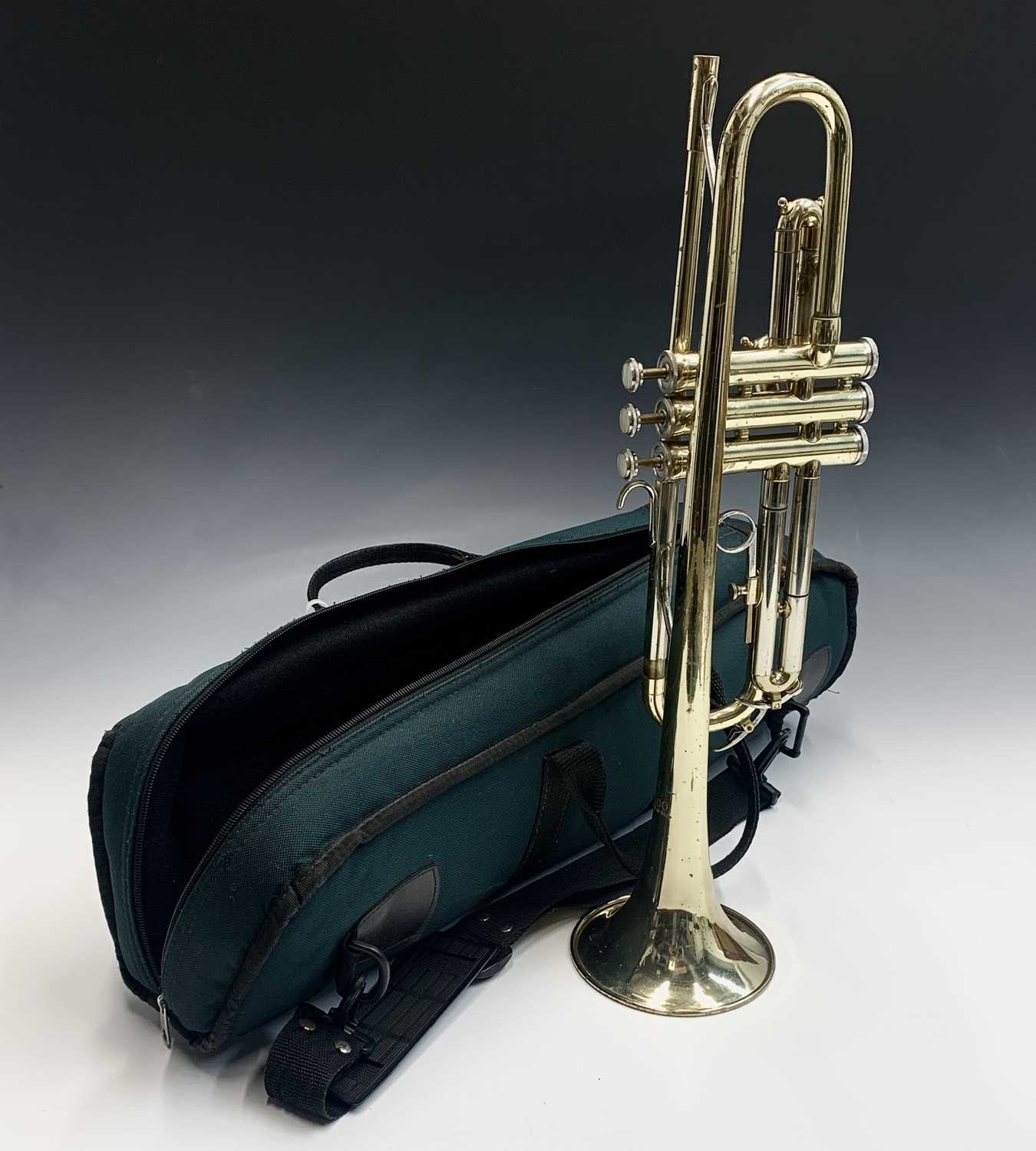 A Boosey & Hawkes B & H 400 brass trumpet, in green bag.