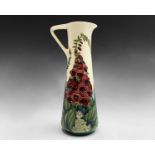 A Moorcroft 'Amberwood' pattern jug, designed by Rachel Bishop, having tube lined foxglove