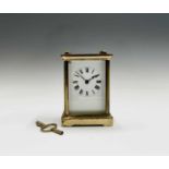 A French brass cased carriage timepiece, the movement stamped with a standing lion, height 11.5cm.