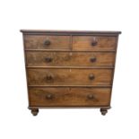 A late Victorian mahogany chest of drawers, with two short and three long graduated drawers, on