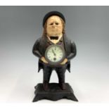 A painted cast iron clock modelled as John Bull, with blinking eye movement, cast inscription '