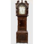 A mid 19th century mahogany and crossbanded 8 day long case clock, the painted arch dial decorated