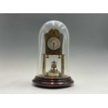 A German 400 day brass torsion clock, the face with Art Nouveau style decoration, the movement