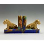 A pair of Beswick bookends, each modelled with a seated terrier. Height 13cm.Condition report: