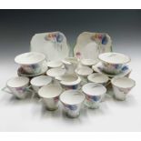 A Shelley Art Deco period tea service, decorated with printed and painted tulip decoration,