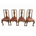 A set of four Queen Anne style walnut dining chairs, height 104cm, width 51cm.