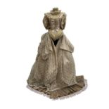 An unusual shop display bust mannequin, dressed in an 18th century style dress, the skirts of