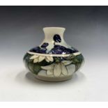 A Moorcroft 'Juneberry' pattern vase of squat ovid form, designed by Anji Davenport, having tube