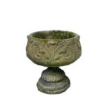 A reconstituted stone pedestal planter with acanthus scroll decoration. Height 46cm, diameter 38cm.