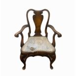 A Queen Anne style walnut open armchair, height 99cm, width 69cm.