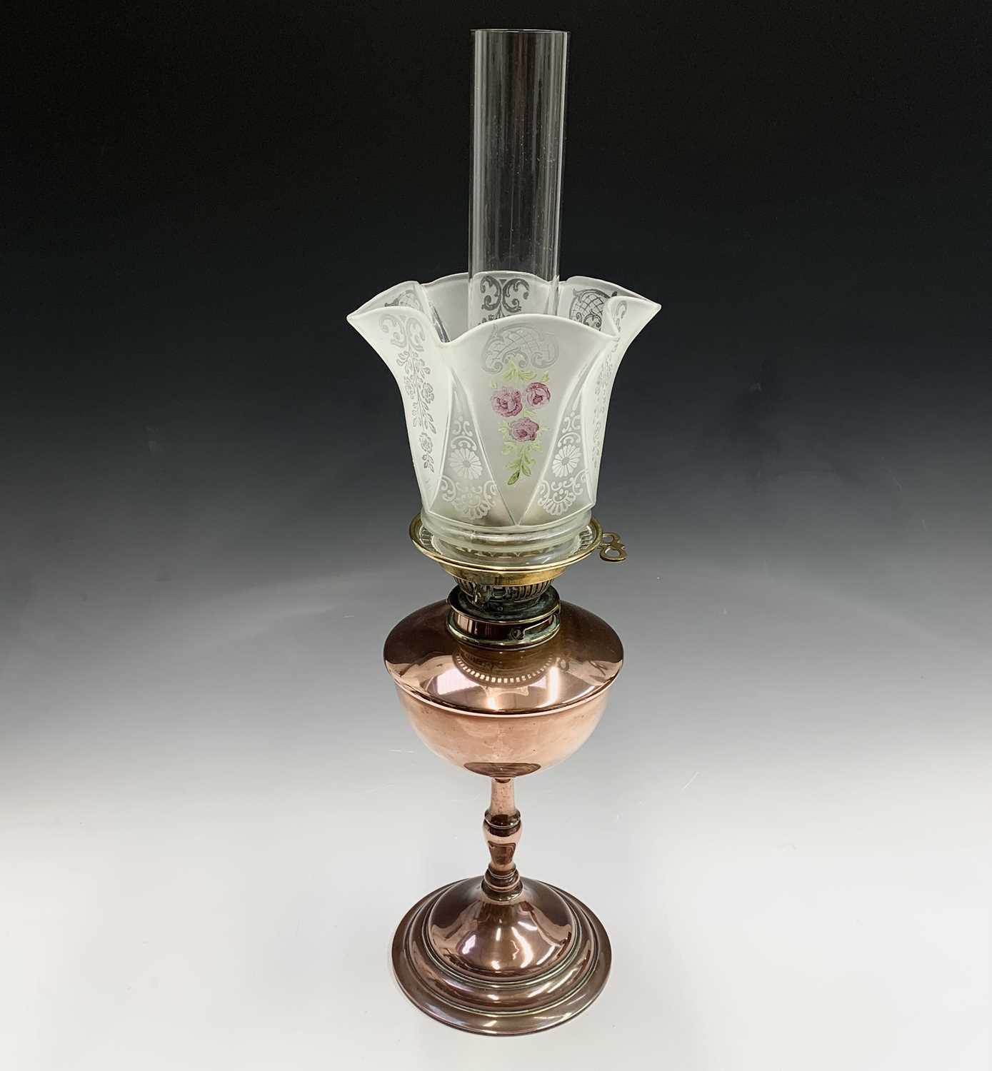 A Messengers Patent copper oil lamp, together with glass shade having acid-etched and painted floral