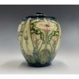 A Moorcroft 'Avensis' pattern lidded jar, designed by Rachel Bishop, having tube lined floral