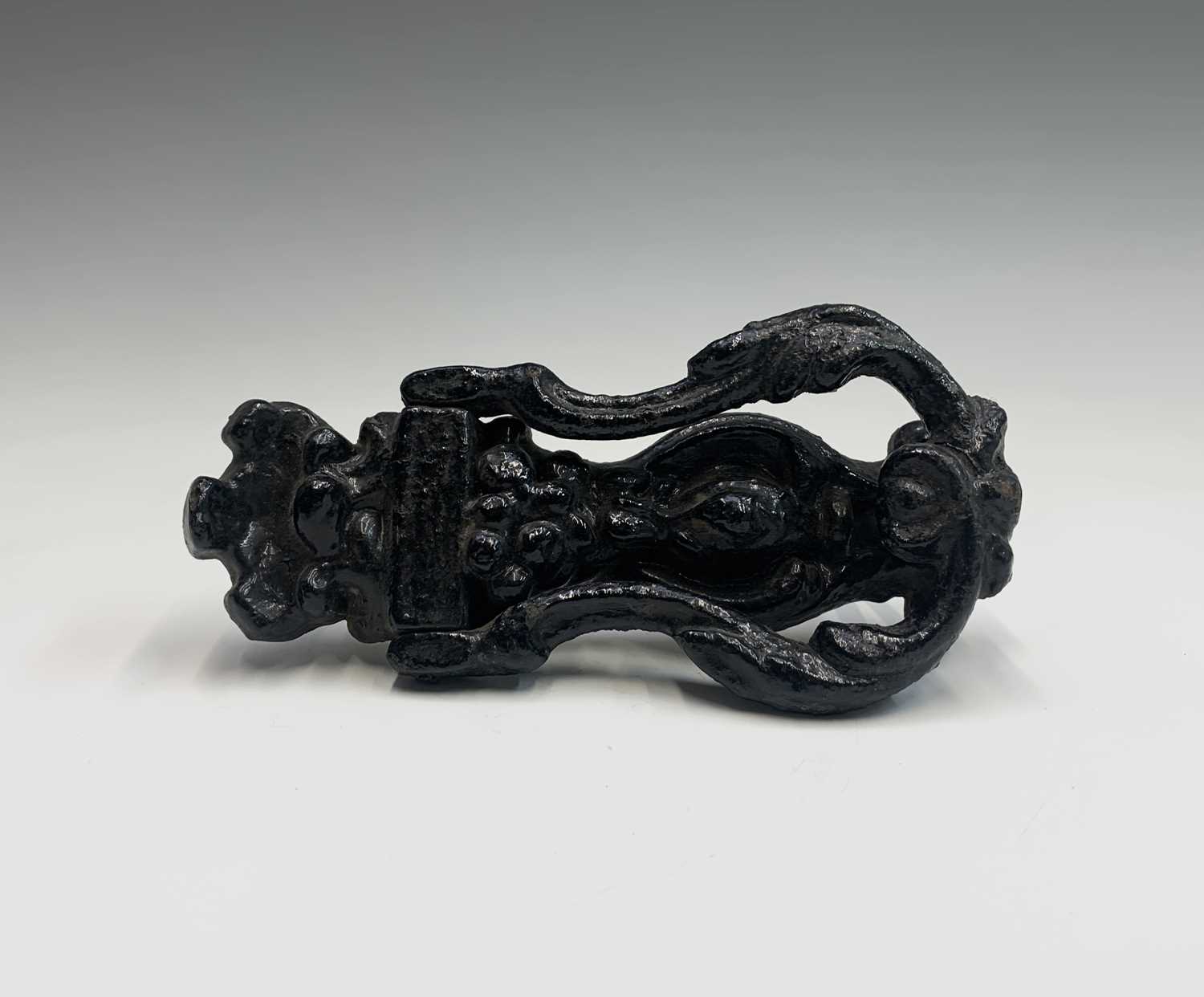 A late Victorian cast iron door knocker, cast with fruit and foliage. Overall height 19cm.