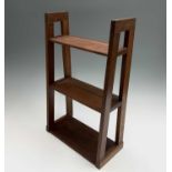 An Edwardian mahogany small display shelf, with three tiers and tapered supports, height 54cm, width