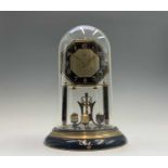 A German Art Deco brass and black enamel torsion clock, the octagonal dial signed Keen, with