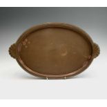 The Birmingham Guild Ltd, A copper tray, of plain oval form, with shell stamped handles, width 41.