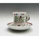 A rare Derby chocolate cup and saucer, circa 1760, with scalloped rims, the cup of bell shape, and