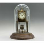 A German 400 day brass torsion clock, circa 1920, by Badische, the cream enamel dial with Arabic