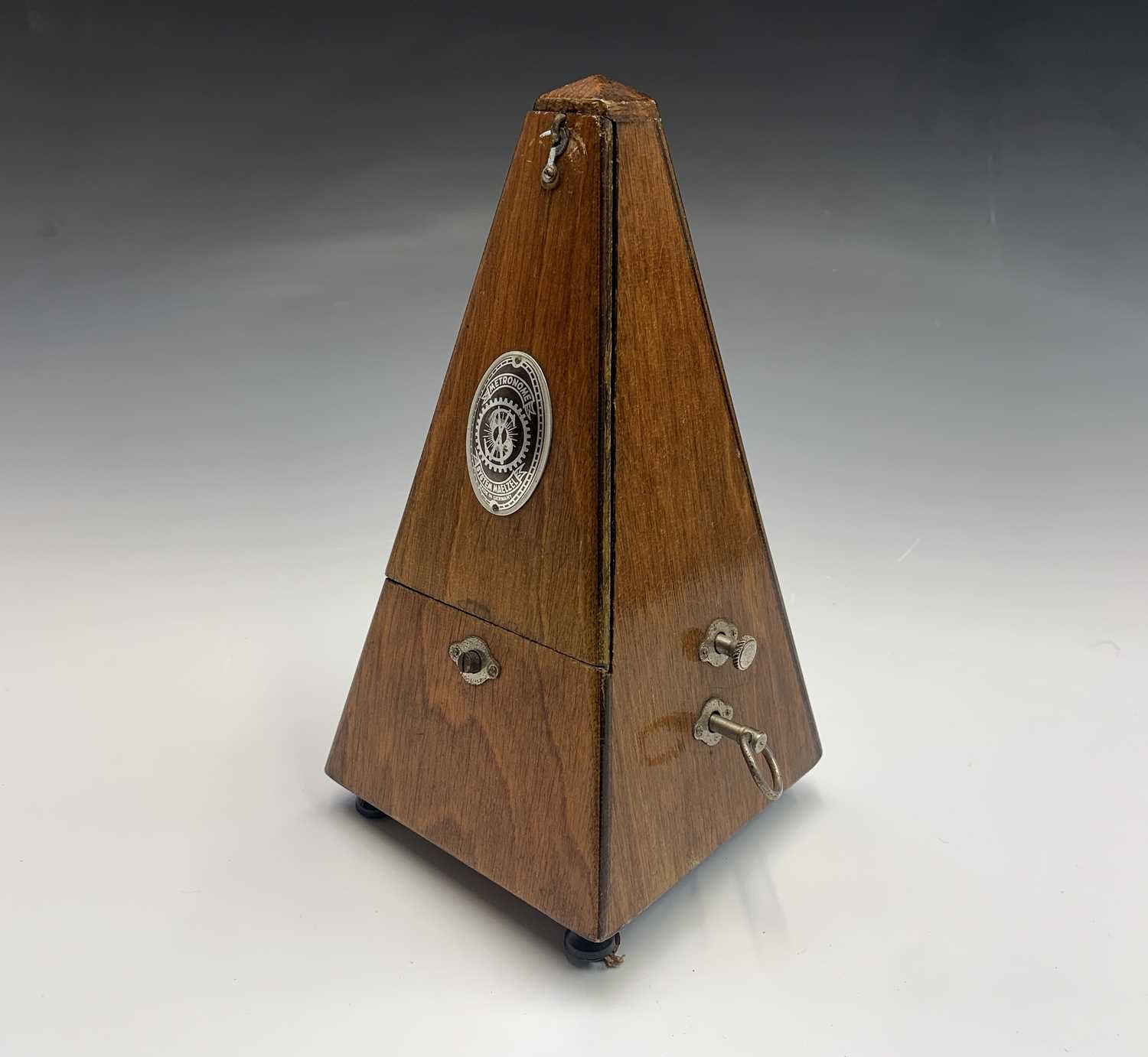 A German made 'System Maelzel' metronome. Height 22cm.