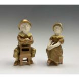 A pair of Royal Worcester shot silk figures of children, late 19th century, after Hadley, the boy
