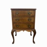 A George III style mahogany three drawer bedside chest, on cabriole legs, height 72cm, width 50cm.