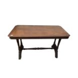 A Victorian walnut centre table, the rectangular moulded top with canted corners, on ring turned