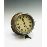 An English brass cased ship's bulkhead clock, circa 1900, the white enamel dial with Roman