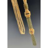Costume JewelleryLong yellow pearl 'Flapper' necklace.A four strand yellow pearl necklace with