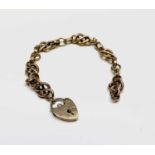 A 9ct gold knot link bracelet 19.3gmCondition report: Length of chain: 19cm, plus padlock: 2cmThis