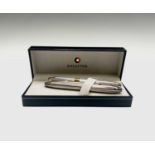 A Sheaffer sterling silver Barlycorn Legacy fountain pen with 18ct gold nib and matching ballpoint
