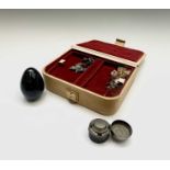 A jewel box and contents including a stone egg