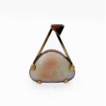 A large triangular opal mounted in 9ct gold by Michael Manzi as a pendant Height 43mm 15.1gm