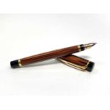 A Waterman Liason orange Ebonite fountain pen with medium 18ct gold nibCondition report: Mechanism