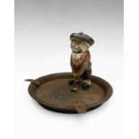 A rare Dunlop golf ball advertising ashtray, in it stands the cast metal cold coloured figure with