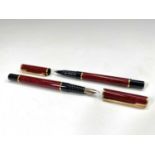 A Waterman Laureat Red fountain pen and matching rollerball pen