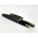A Parker Sonnet dark grey fountain pen with 18ct gold medium nib date code IIIU empty cartridge