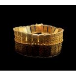A 9ct gold bracelet with flower head panels 17.1gmCondition report: Each of the decorated panels