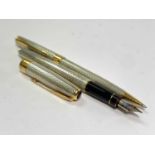 A Parker Sonnet silver Fougere fountain pen with 18ct medium nib and gold trim date IIE and a
