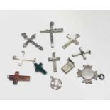 Eleven various crosses including one in malachite mounted with high purity gold, the largest 64mm.