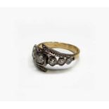 An antique style gold ring set with navette and other diamonds totalling just over 1ct 5.7gm