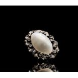 A Belle Epoch oval blister pearl brooch with a band of diamonds 26x19mm 6.3gm