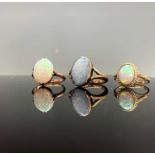 Three gold rings each set an oval opal 8.5gmCondition report: Rubbed over setting Size O 1/2 1928